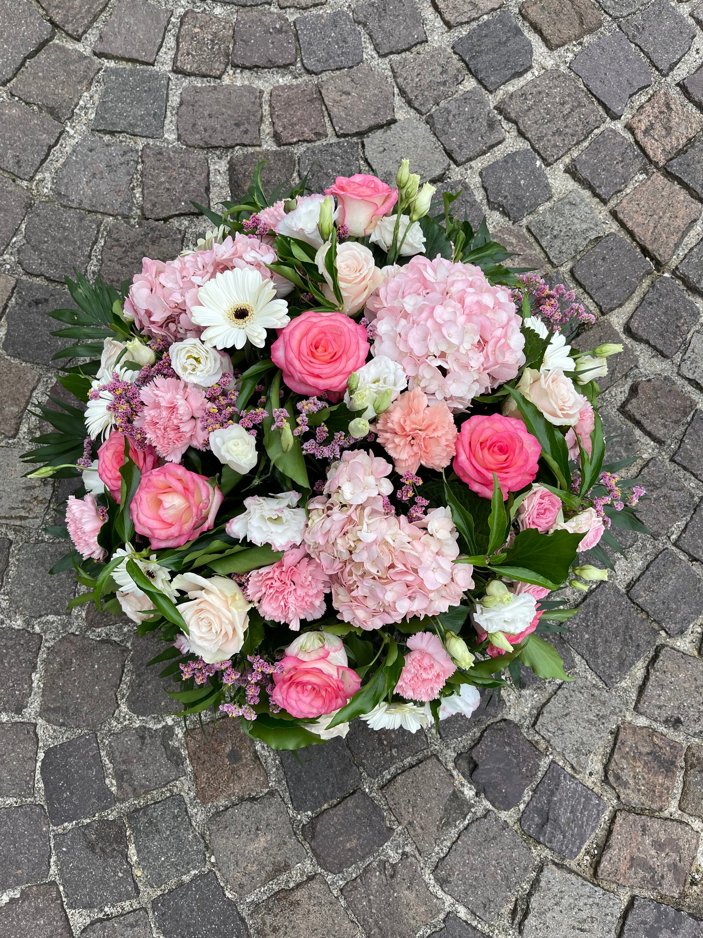 Coussin rond camaïeu de rose/blanc