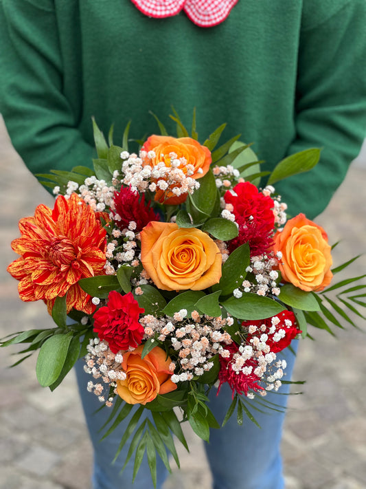 Bouquet de  fleurs variées teintes chaudes